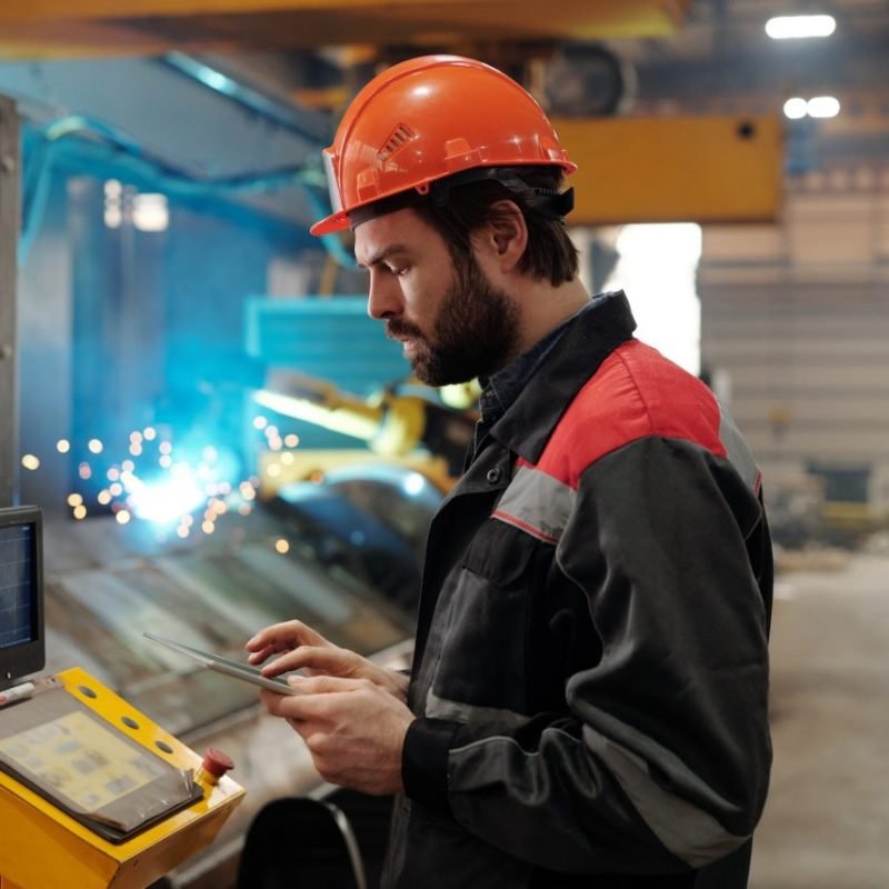 side-view-of-young-engineer-in-workwear-using-digital-tablet.jpg side-view-of-young-engineer-in-workwear-using-digital-tablet.jpg